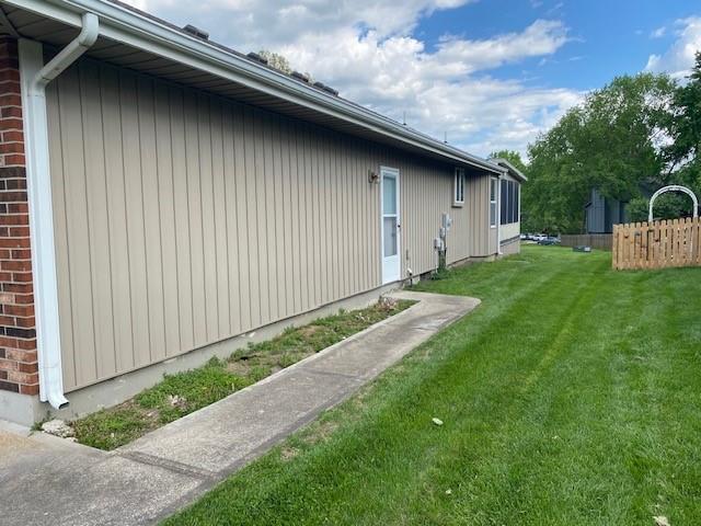 view of side of property with brick siding