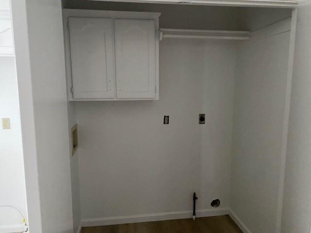 laundry area with cabinet space, baseboards, wood finished floors, and electric dryer hookup