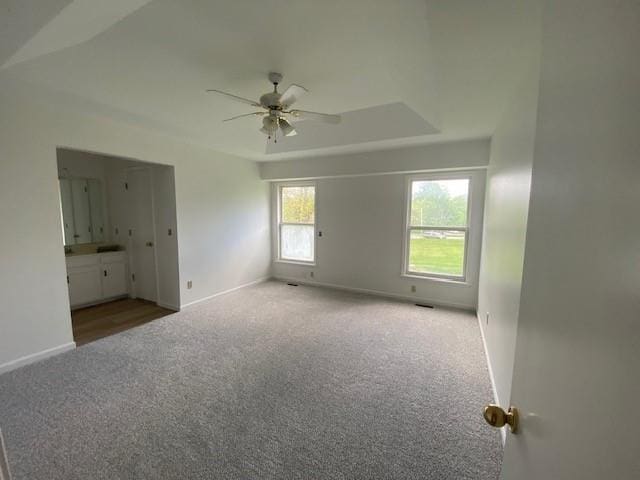 unfurnished bedroom featuring carpet flooring and baseboards