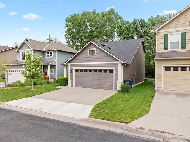 view of front of property with a front lawn and concrete driveway