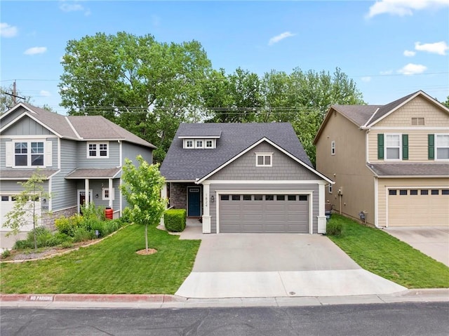 craftsman-style house with driveway, a front yard, and an attached garage