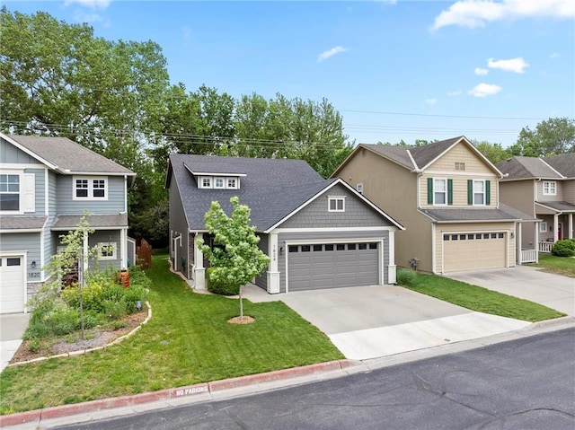 view of front of house with concrete driveway and a front yard