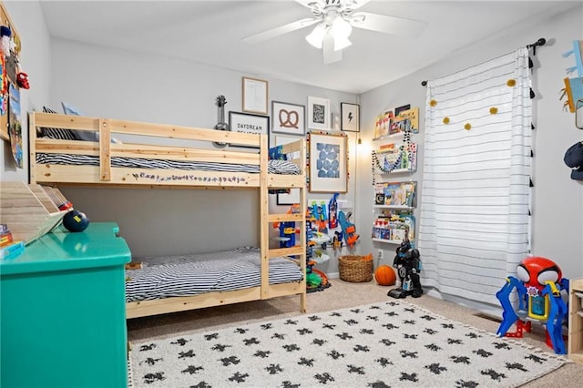 carpeted bedroom featuring a ceiling fan