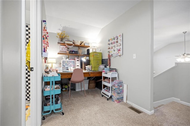 carpeted office with lofted ceiling, ceiling fan, and baseboards