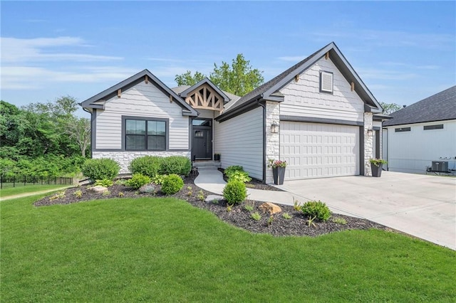 18235 NW 127th St, Platte City, MO 64079 - view of front of house with stone siding, central AC, a front yard, driveway, and a garage