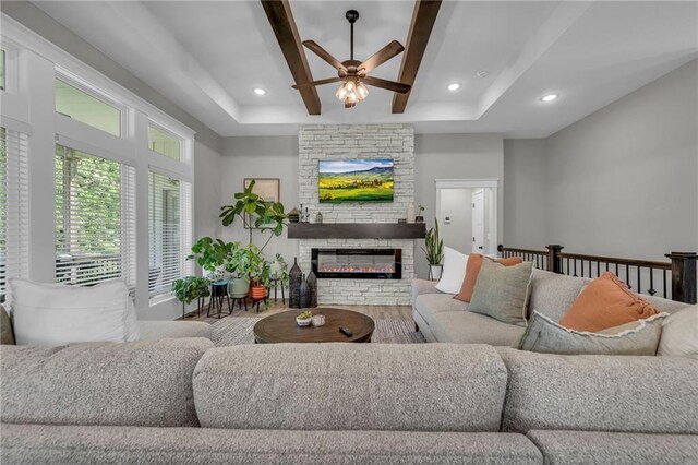 18235 NW 127th St, Platte City, MO 64079 - living area featuring ceiling fan, a raised ceiling, a fireplace, wood finished floors, and recessed lighting