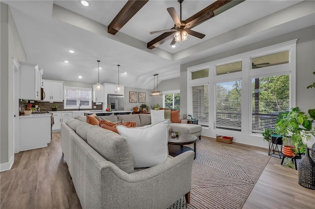 18235 NW 127th St, Platte City, MO 64079 - living area featuring ceiling fan, light wood finished floors, recessed lighting, and beamed ceiling