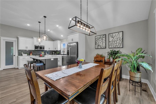18235 NW 127th St, Platte City, MO 64079 - dining room featuring lofted ceiling, light wood finished floors, baseboards, and recessed lighting