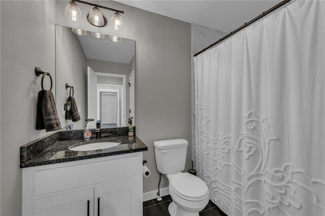 18235 NW 127th St, Platte City, MO 64079 - bathroom with tile patterned floors, vanity, toilet, baseboards, and a shower with shower curtain