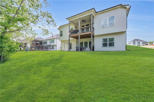 18235 NW 127th St, Platte City, MO 64079 - rear view of house featuring a balcony, a ceiling fan, and a lawn
