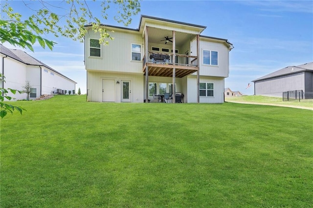 18235 NW 127th St, Platte City, MO 64079 - rear view of house with a ceiling fan, a balcony, and a yard