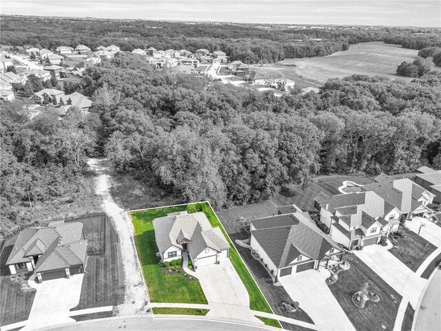 18235 NW 127th St, Platte City, MO 64079 - aerial view of residential area with a heavily wooded area and property boundaries highlighted