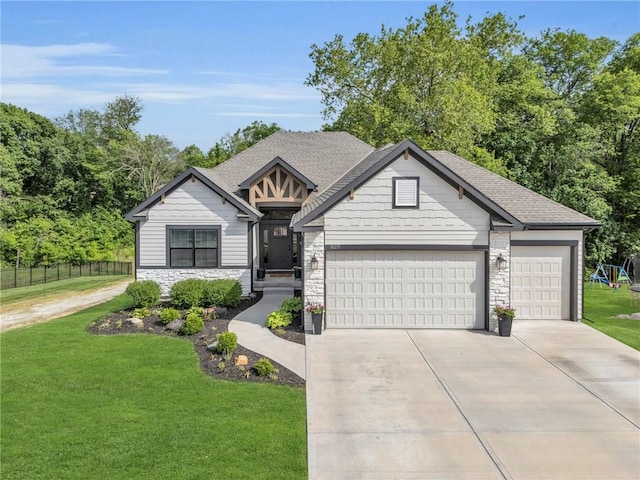 18235 NW 127th St, Platte City, MO 64079 - view of front of home with stone siding, driveway, a garage, and a shingled roof