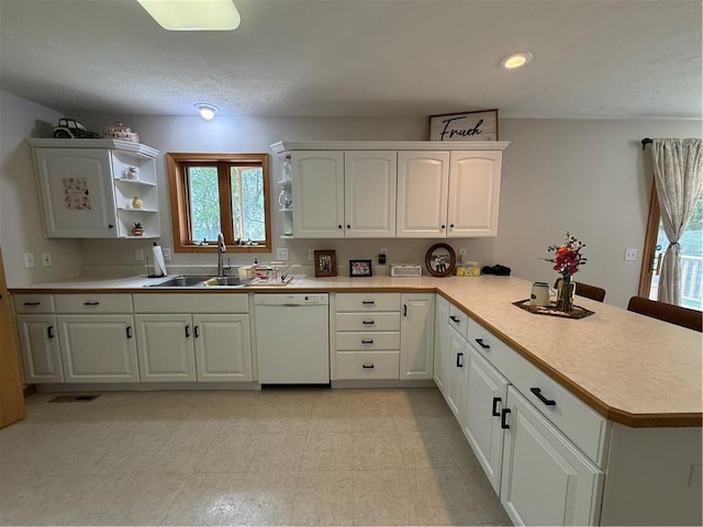 727 Serenity Loop, Maryville, MO 64468 - kitchen with a sink, white dishwasher, a peninsula, light countertops, and recessed lighting