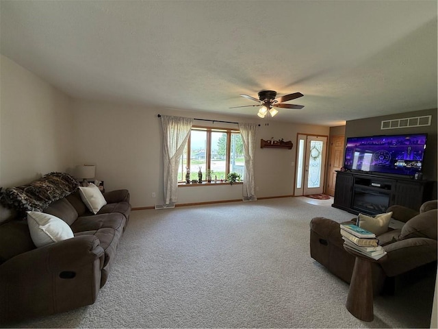 727 Serenity Loop, Maryville, MO 64468 - carpeted living room with baseboards and a ceiling fan