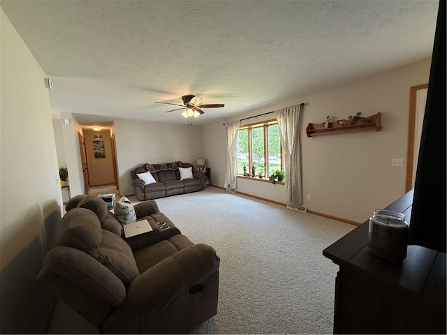 727 Serenity Loop, Maryville, MO 64468 - carpeted living area featuring a textured ceiling, a ceiling fan, and baseboards