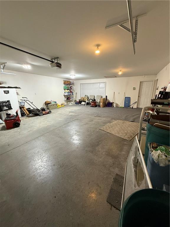 727 Serenity Loop, Maryville, MO 64468 - garage featuring a garage door opener