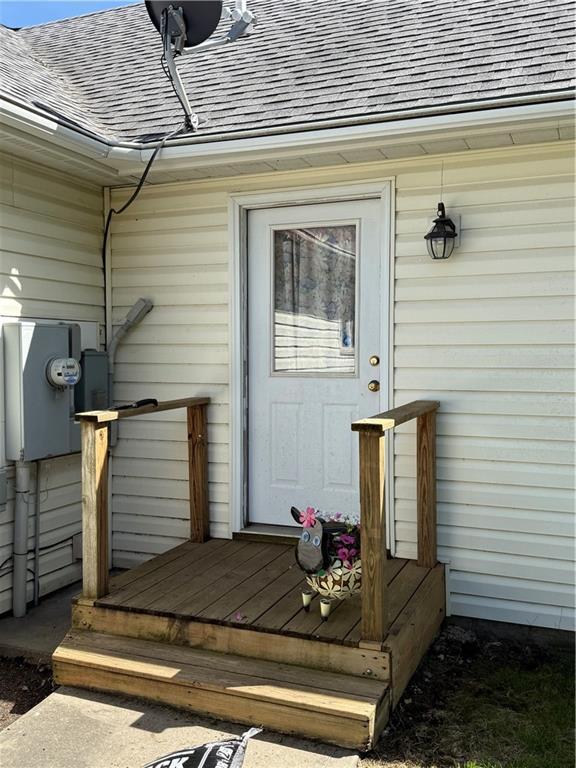 727 Serenity Loop, Maryville, MO 64468 - property entrance with a shingled roof