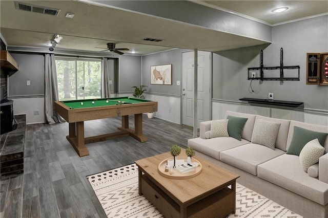 recreation room with crown molding, dark wood finished floors, pool table, a wainscoted wall, and ceiling fan