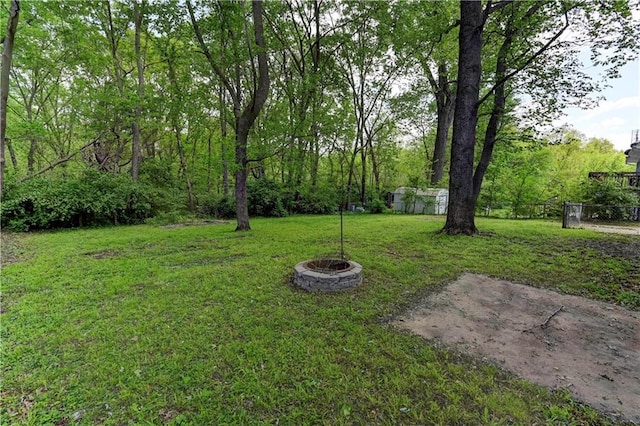 view of yard with an outdoor fire pit