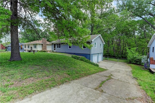 single story home featuring an attached garage and driveway