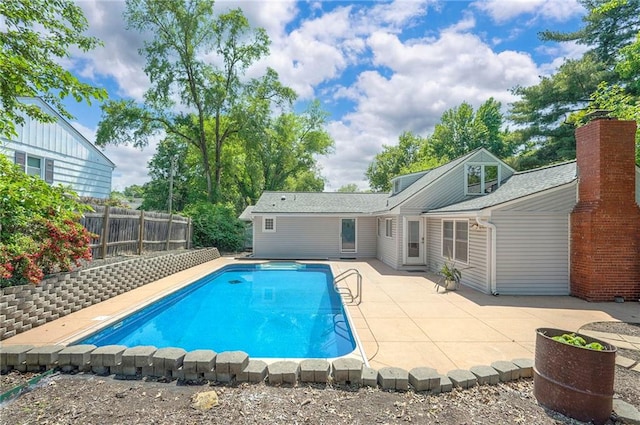 6021 Robinson Ln, Overland Park, KS 66202 - view of swimming pool with a patio and a fenced backyard