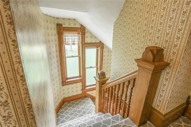 bonus room featuring vaulted ceiling, wallpapered walls, baseboards, and carpet floors