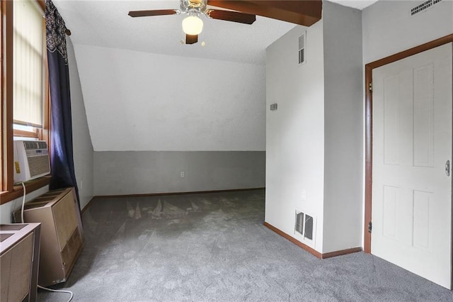 empty room featuring carpet, ceiling fan, cooling unit, and baseboards