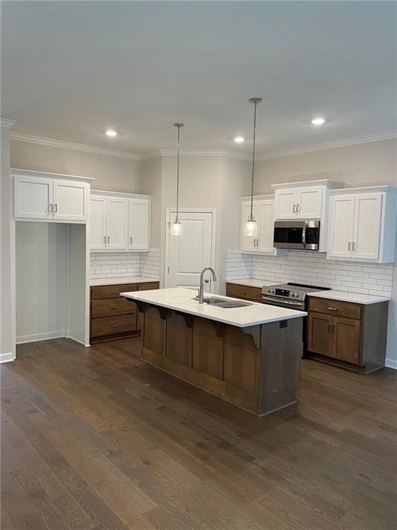 10617 N Fisk Ave, Kansas City, MO 64154 - kitchen with stainless steel appliances, a sink, white cabinetry, backsplash, and light countertops
