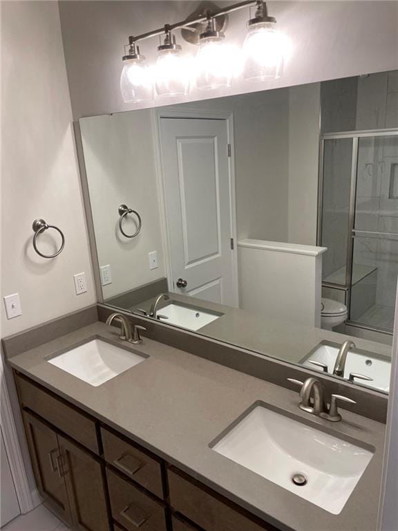 10617 N Fisk Ave, Kansas City, MO 64154 - bathroom with a stall shower, toilet, and double vanity
