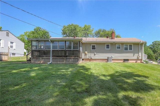 11205 E 49th St, Kansas City, MO 64133 - back of property featuring a sunroom and a chimney