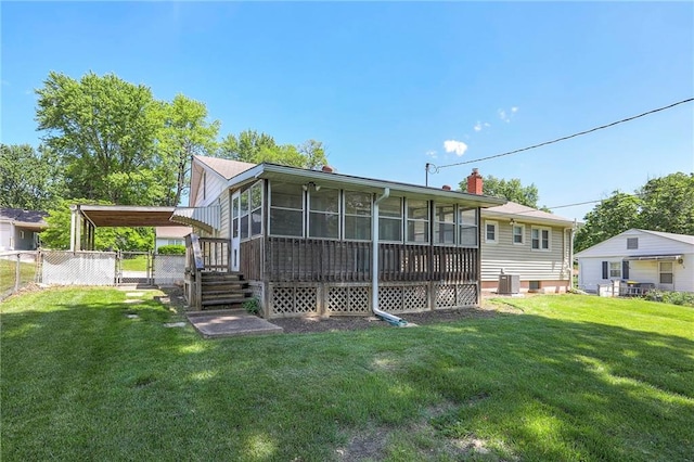 11205 E 49th St, Kansas City, MO 64133 - rear view of house with a sunroom, a gate, cooling unit, and a chimney