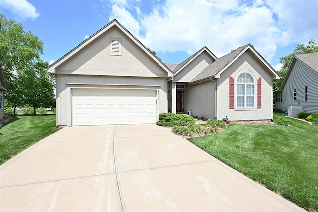 3112 NW 86th St, Kansas City, MO 64154 - ranch-style home with concrete driveway, stucco siding, a front yard, an attached garage, and cooling unit