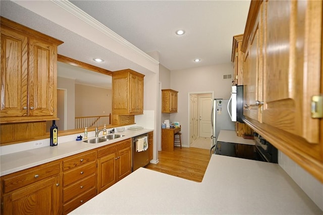 3112 NW 86th St, Kansas City, MO 64154 - kitchen featuring appliances with stainless steel finishes, a sink, light countertops, recessed lighting, and light wood-style floors