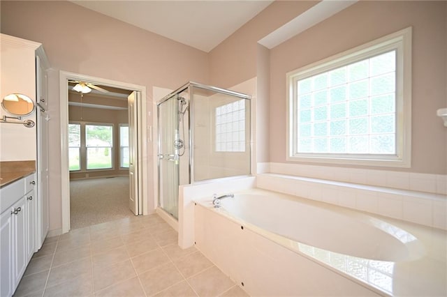 3112 NW 86th St, Kansas City, MO 64154 - full bath featuring a shower stall, a garden tub, tile patterned floors, vanity, and a ceiling fan