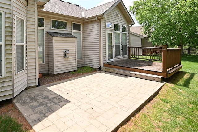 3112 NW 86th St, Kansas City, MO 64154 - back of house with a patio, a wooden deck, a shingled roof, and a yard