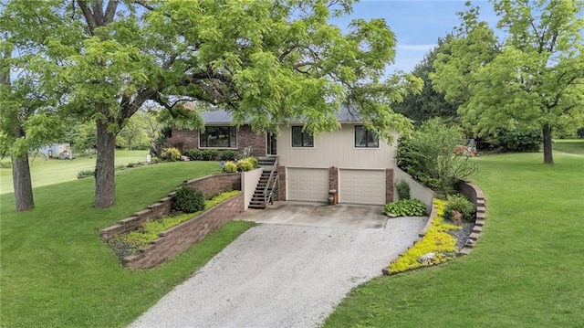 1758 Labette Rd, Ottawa, KS 66067 - view of front of property with stairway, driveway, an attached garage, brick siding, and a front yard