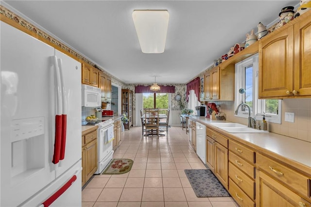 1758 Labette Rd, Ottawa, KS 66067 - kitchen featuring white appliances, a sink, light countertops, and backsplash