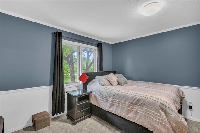 1758 Labette Rd, Ottawa, KS 66067 - bedroom featuring carpet floors, a wainscoted wall, and crown molding