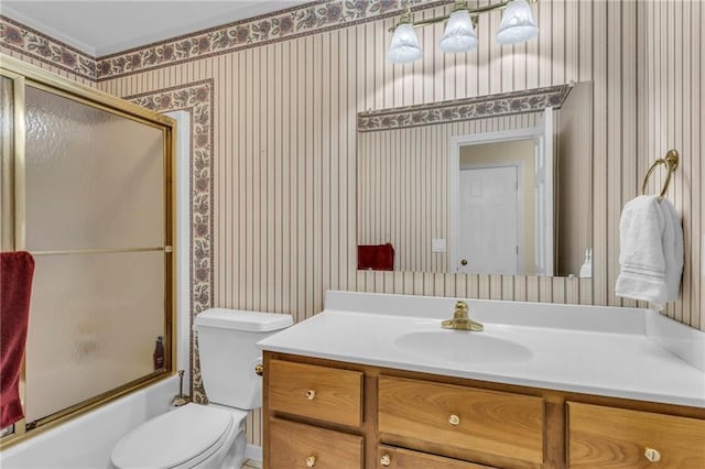 1758 Labette Rd, Ottawa, KS 66067 - full bath with wallpapered walls, toilet, vanity, and shower / bath combination with glass door