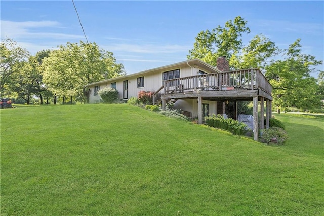 1758 Labette Rd, Ottawa, KS 66067 - rear view of property with a chimney, a deck, and a lawn