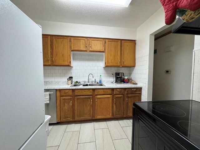 1606 N Ponca Dr, Independence, MO 64058 - kitchen featuring a sink, brown cabinets, stainless steel dishwasher, light countertops, and black electric range oven