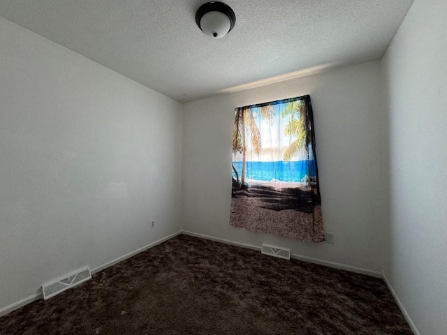 1606 N Ponca Dr, Independence, MO 64058 - unfurnished room featuring carpet, baseboards, and a textured ceiling
