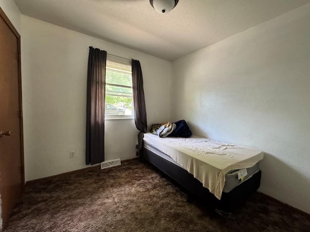 1606 N Ponca Dr, Independence, MO 64058 - bedroom with carpet flooring and a textured ceiling