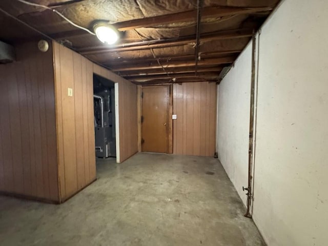 1606 N Ponca Dr, Independence, MO 64058 - unfinished basement featuring wooden walls