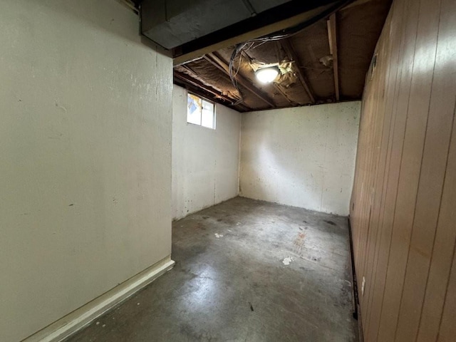 1606 N Ponca Dr, Independence, MO 64058 - below grade area featuring wood walls