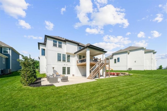 15624 Delmar St, Overland Park, KS 66224 - back of house featuring a patio area, stairs, central air condition unit, outdoor lounge area, and a lawn