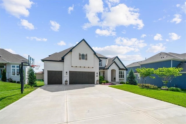 15624 Delmar St, Overland Park, KS 66224 - french provincial home featuring a front lawn, concrete driveway, stucco siding, and an attached garage