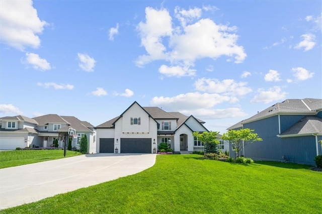 15624 Delmar St, Overland Park, KS 66224 - view of front of property with a front lawn, concrete driveway, and board and batten siding