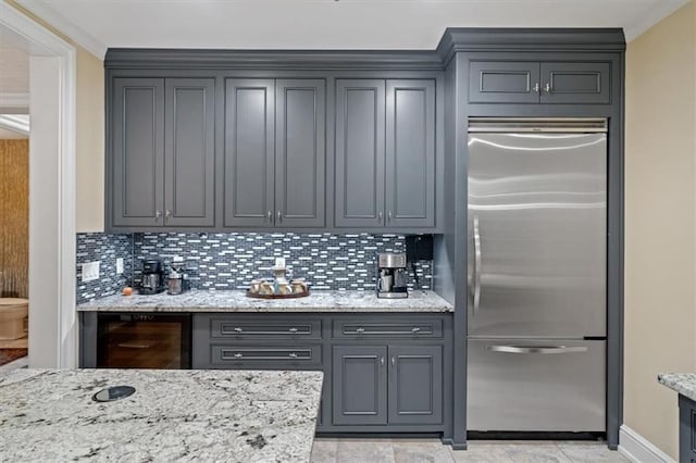 4801 W 133rd St Unit 204, Leawood, KS 66209 - kitchen with stainless steel built in fridge, wine cooler, decorative backsplash, gray cabinets, and crown molding